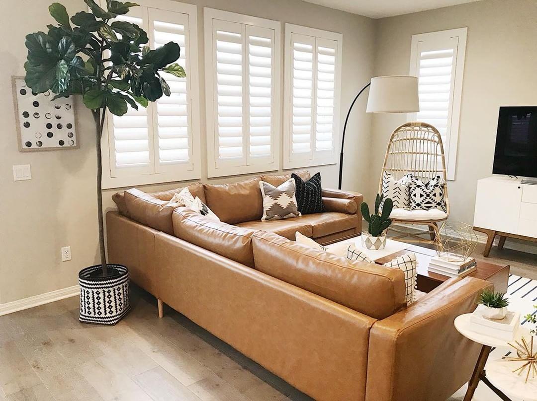 Cozy living room with our Polywood shutters in Miami.